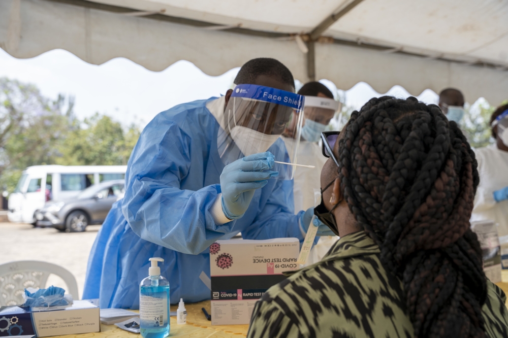 A health worker conducts  the covid 19 mass testing in Kigali on July 17, 2021. Craish Bahizi