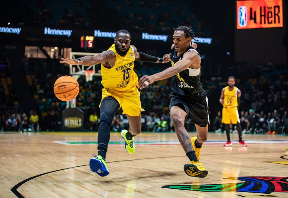 Petro Atletico&#039;s Aboubakar Gakou and Tigers&#039; Nkosinathi Nsibanyoni vie for a ball during the pair&#039;s BAL semifinal game on Wednesday night at BK Arena. Petro will face Libya&#039;s Al Ahly Ly in the final on Saturday, June 1-Dan Gatsinzi.
