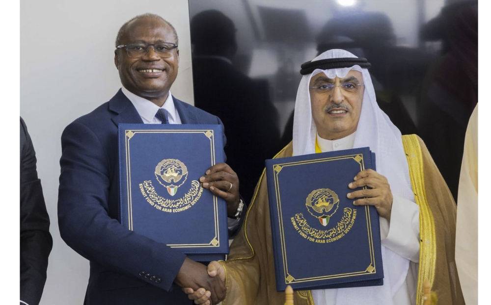  The Minister of Finance and Economic Planning, Uzziel Ndagijimana, and the Ag. Director General of Kuwait Fund for Arab Economic Development, Waleed Al-Bahar, during the signing of a concessional $20 million (about Rwf 26 billion) loan agreement on the sidelines of the African Development Bank Annual Meeting in Nairobi, Kenya, on Thursday, May 30. The funds will go toward rehabilitation of Muhanga-Nyange road. Courtesy.