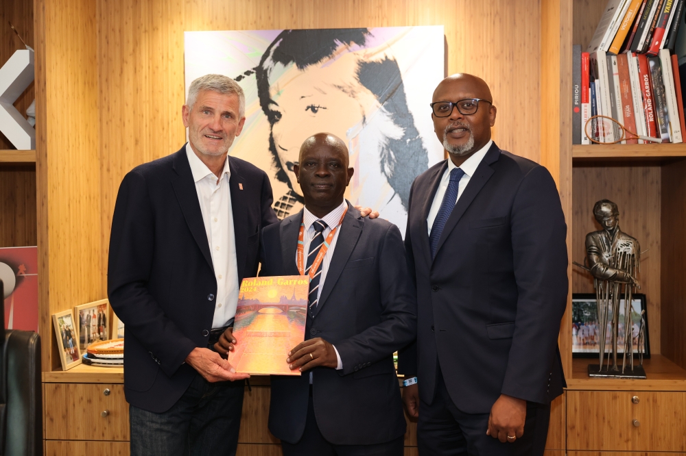 FFT&#039;s Gilles Moretton and RTF&#039;s Theoneste Karenzi and Rwandan ambassador to France François Nkulikiyimfura pose for a photo after signing the partnership on Thursday, May 30 