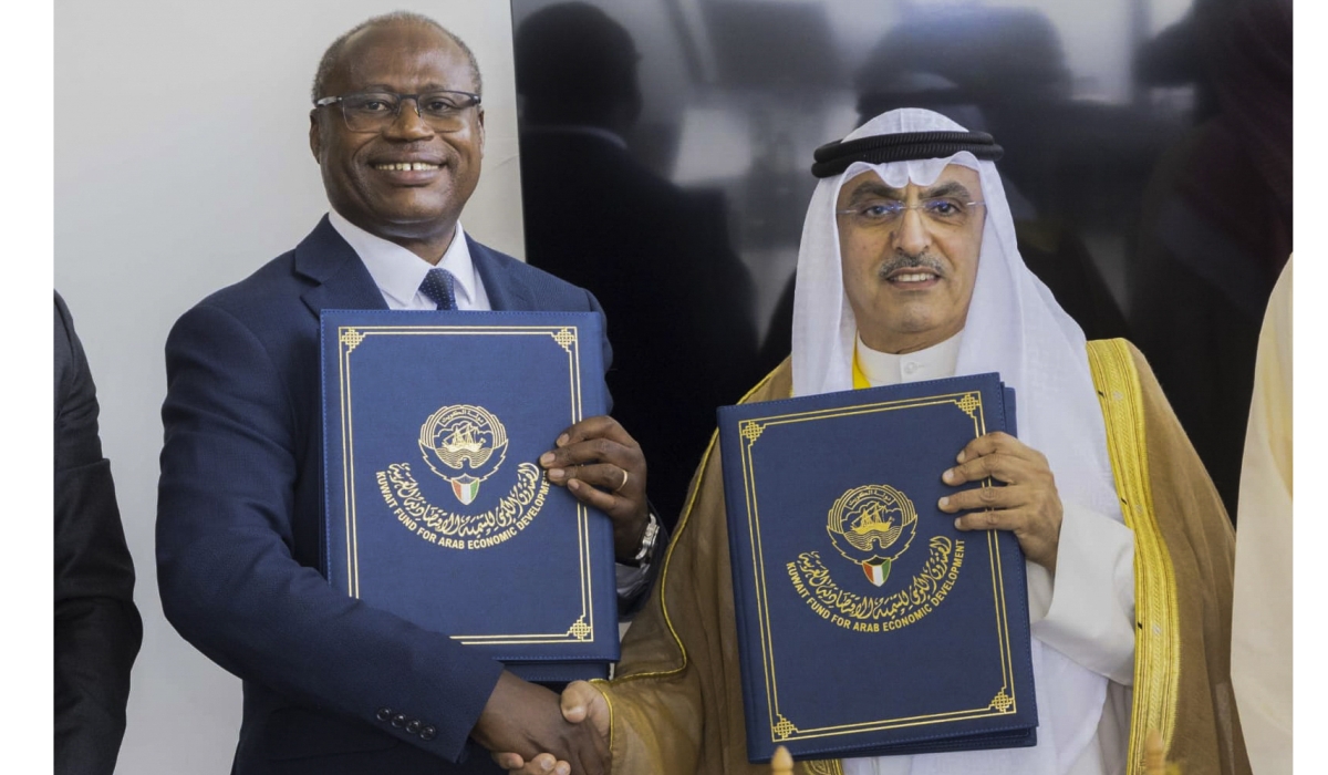  The Minister of Finance and Economic Planning, Uzziel Ndagijimana, and the Ag. Director General of Kuwait Fund for Arab Economic Development, Waleed Al-Bahar, during the signing of a concessional $20 million (about Rwf 26 billion) loan agreement on the sidelines of the African Development Bank Annual Meeting in Nairobi, Kenya, on Thursday, May 30. The funds will go toward rehabilitation of Muhanga-Nyange road. Courtesy.