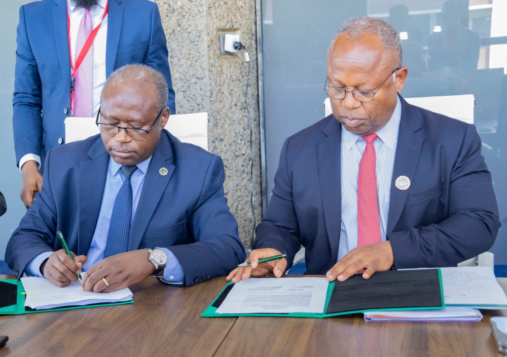Finance Minister Uzziel Ndagijimana  and Alain Ebobissé Chief Executive Officer of Africa50, sign the agreement in Nairobi, Kenya on Friday, May 31. Courtesy