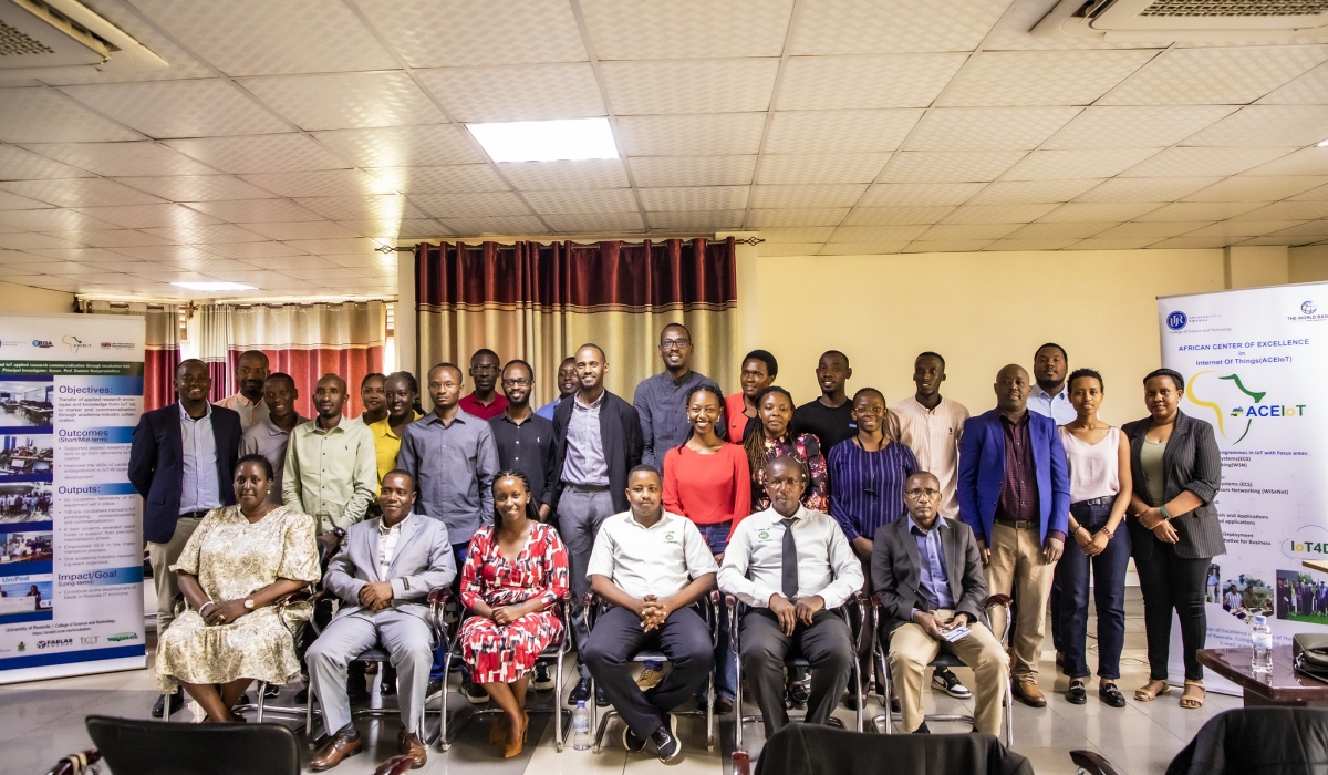 Participants pose for a group photo at a workshop on a project titled “IoT and AI Applied Research Result Commercialization Through Incubation Hub”. Emmanuel Dushimimana