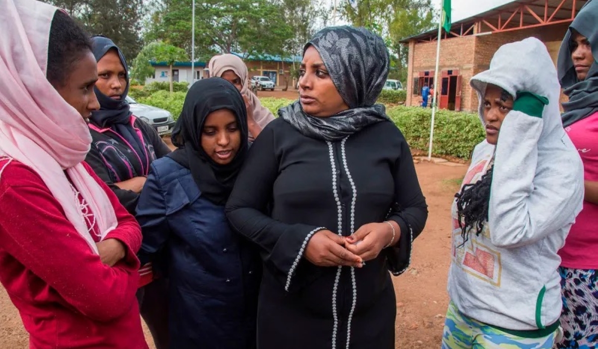Asylum seekers, who were evacuated from Libya, have a chat inside the Gashora Emergency Transit Centre in Bugesera, southeast of Rwanda. The facility is a temporary safe shelter for asylum seekers before they are processed and relocated to third countries.