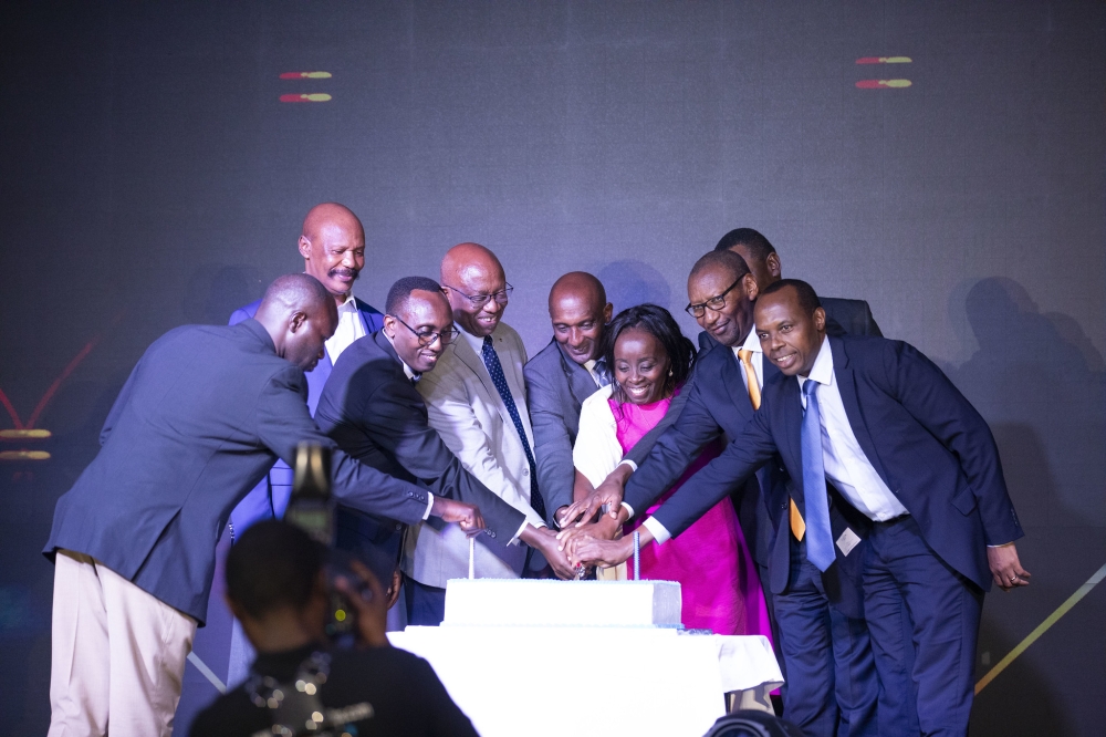 Officials cut a cake as I&M Bank Rwanda celebrated its golden jubilee marking 50 years of financial sector on June 13. Photos by Emmanuel Dushimimana