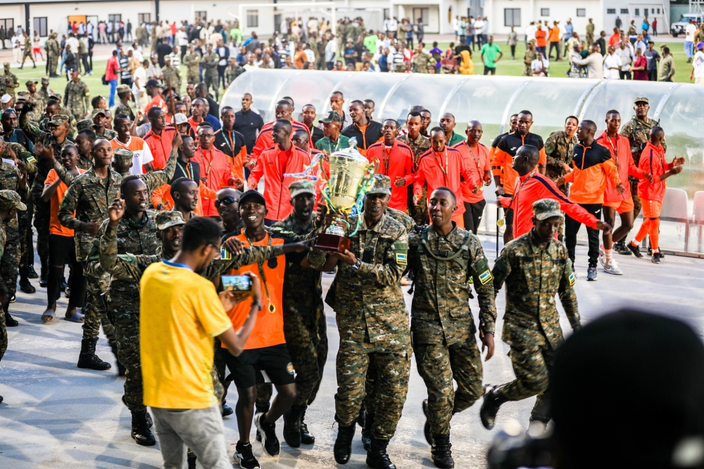 The Republican Guard team players and supporters celebrate the victory for winning their third straight RDF Liberation Cup tournament after defeating BMTC Nasho 3-0 in the 2024 final match at Kigali Pele stadium on Sunday, June 16. Photo by Craish Bahizi