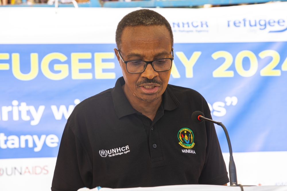 The Minister in Charge of Emergency Management , Maj. Gen (Rtd) Albert Murasira  addressing hundreds of people  at Mugombwa Refugee Camp, Gisagara District on Thursday, June 20