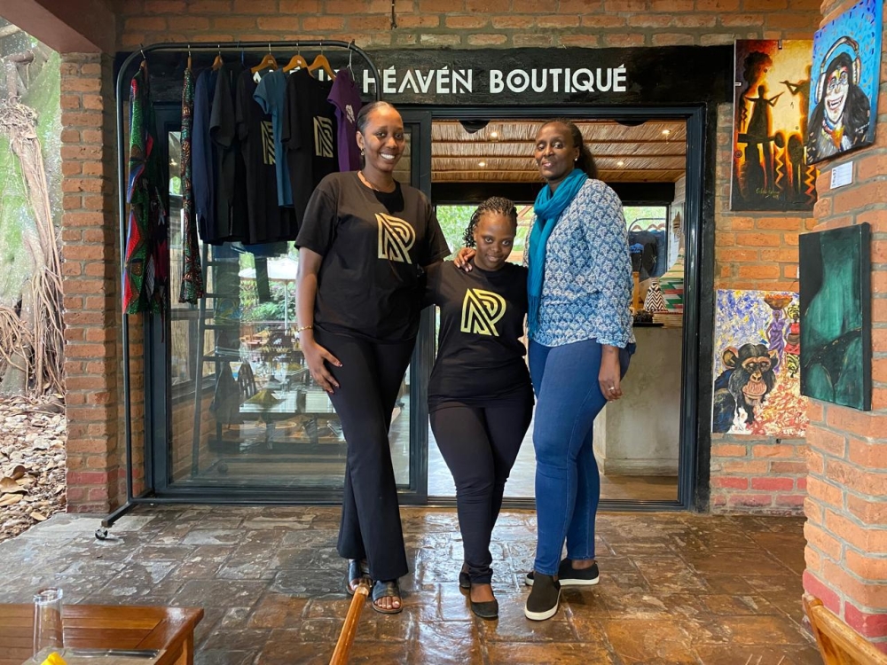 Fidelia Uwizakiza (c) with her co-worker (L) and Edwige Musabe the  Executive Secretary of RDSO