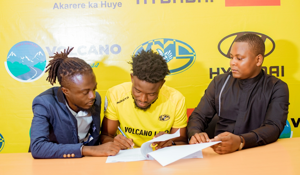 Abdul Jalilu with his manager and Managing Director of Mukura VS Protais Musoni when he was signing the contract