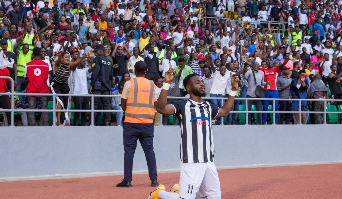 APR FC goal scorer Gilbert Mugisha celebrates his goal during a friendly match between 2023-24 Primus National League champions APR FC and Peace Cup winners Police FC.
