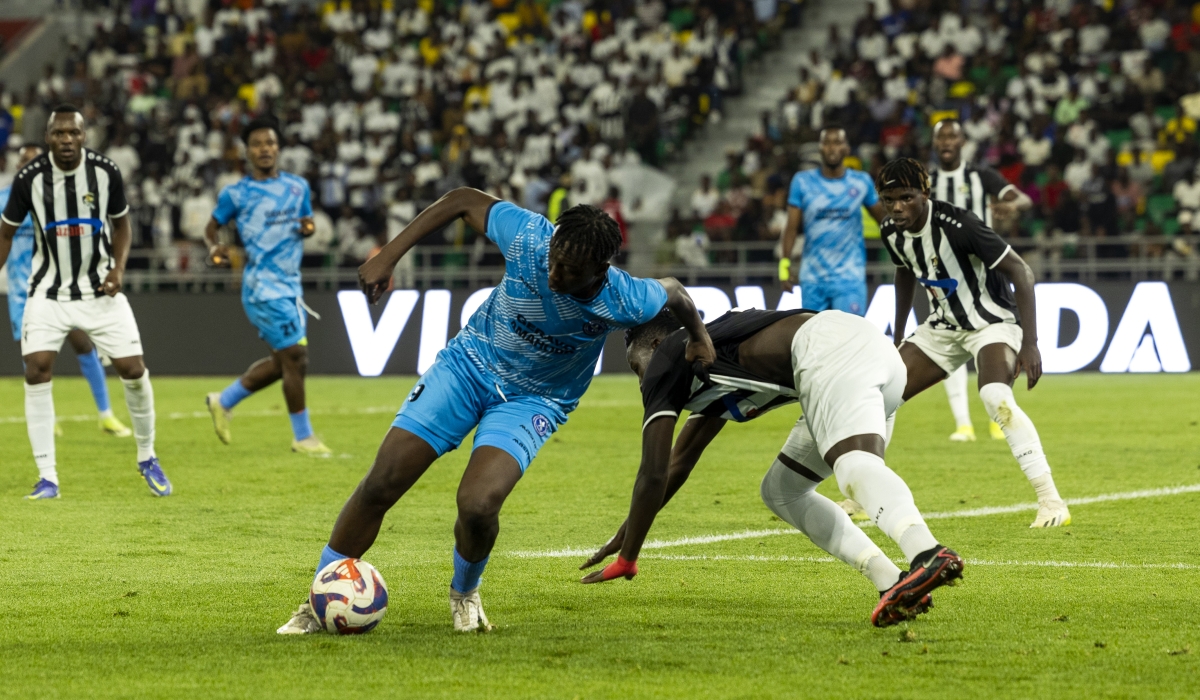 APR FC and Police FC players vie for the ball during a 1-0 friendly match  at  Amahoro Stadium on Monday, July 1. Olivier Mugwiza