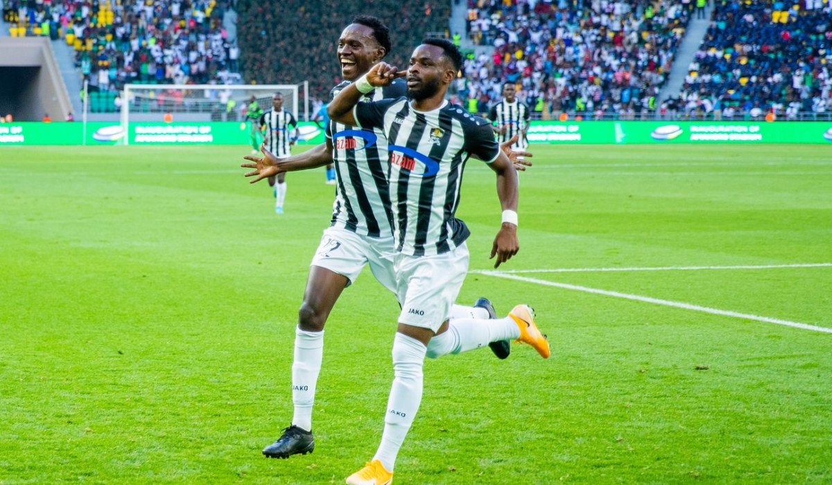 APR FC winger Gilbert Mugisha (R) and teammate celebrate a goal as they beat Police FC 1-0 during the inauguration of Amahoro Stadium. Olivier Mugwiza
