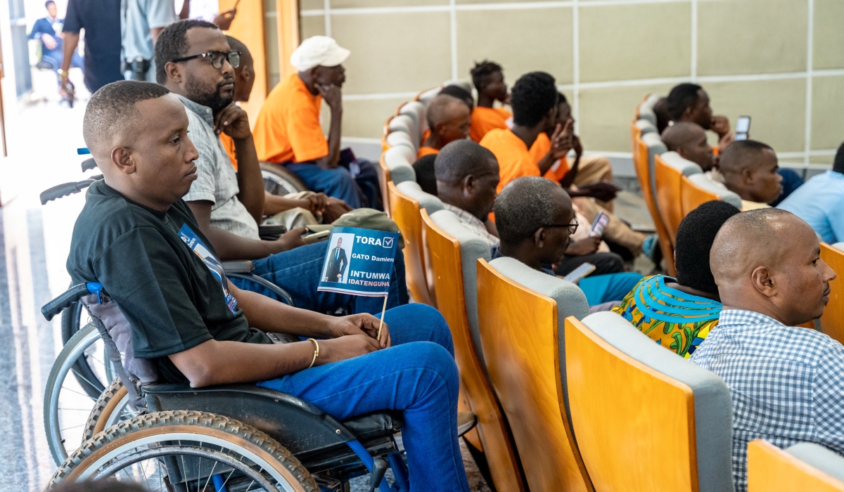 People with disabilities follow candidates&#039; manifesto during the launch of their campaign in Kigali, on July 2. Craish Bahizi