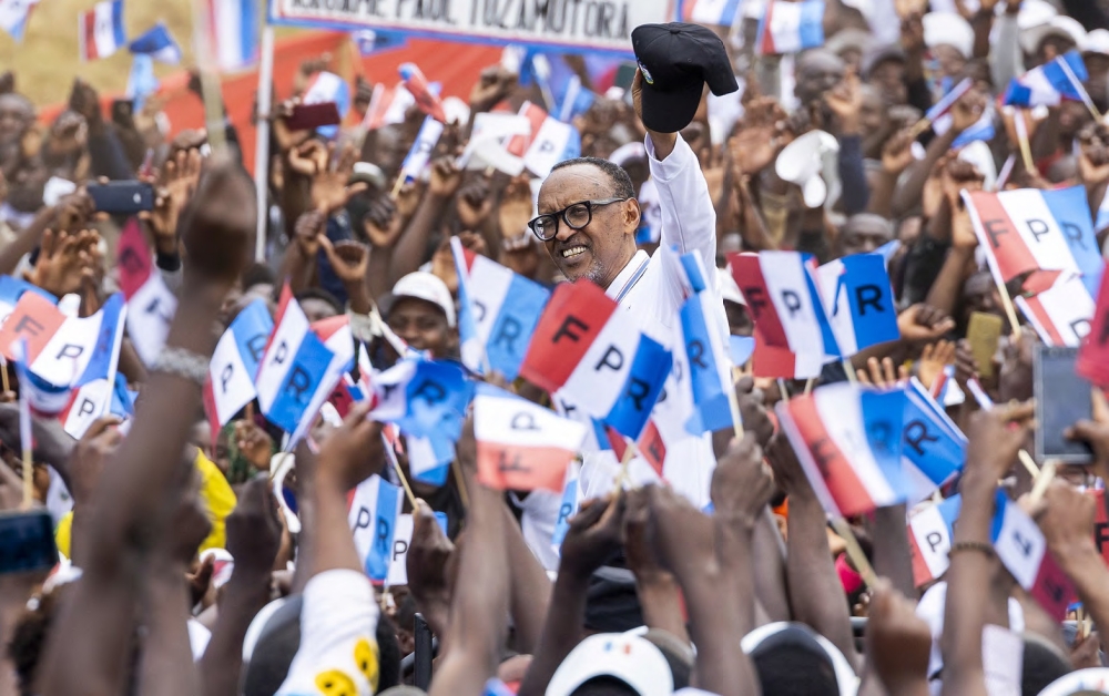 RPF Inkotanyi flag bearer President Paul Kagame greets thousands of supporters during the campaign in Musanze District on June 22. Photo: Olivier Mugwiza