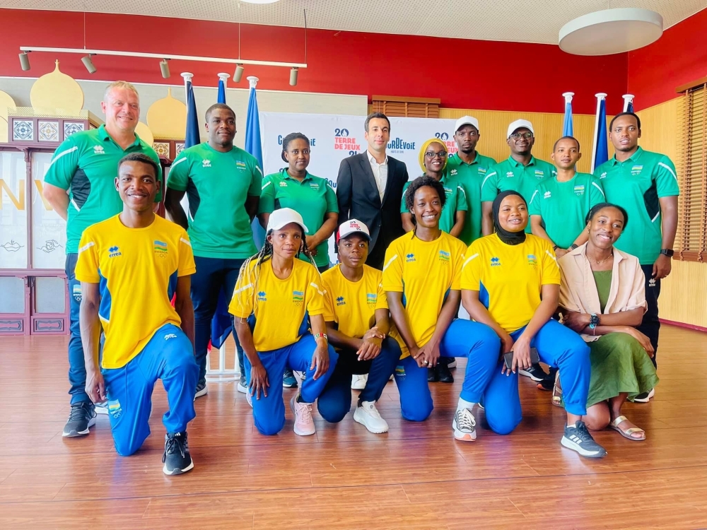 Courbevoie deputy mayor Khalid Ait Omar (fourth left, back row) poses for a picture with Rwanda&#039;s Olympics team.
