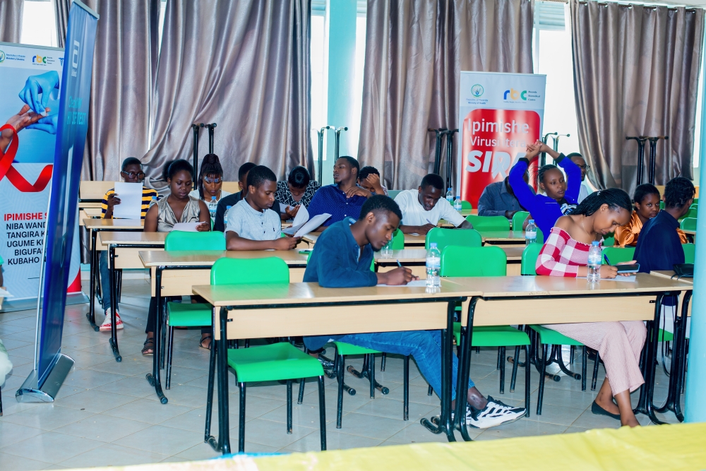 Students fill questionnaires about self testing before voluntarily trying out the kits in private. (File Photo)