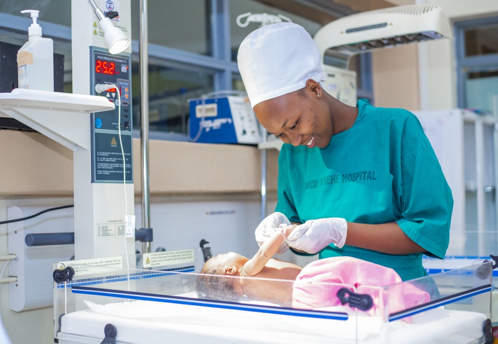 A nurse takes care of a newborn at Kirehe Hospital. Surrogacy is a form of third-party reproductive practice in which the intending parent(s) contract a surrogate mother to give birth to a child. File 