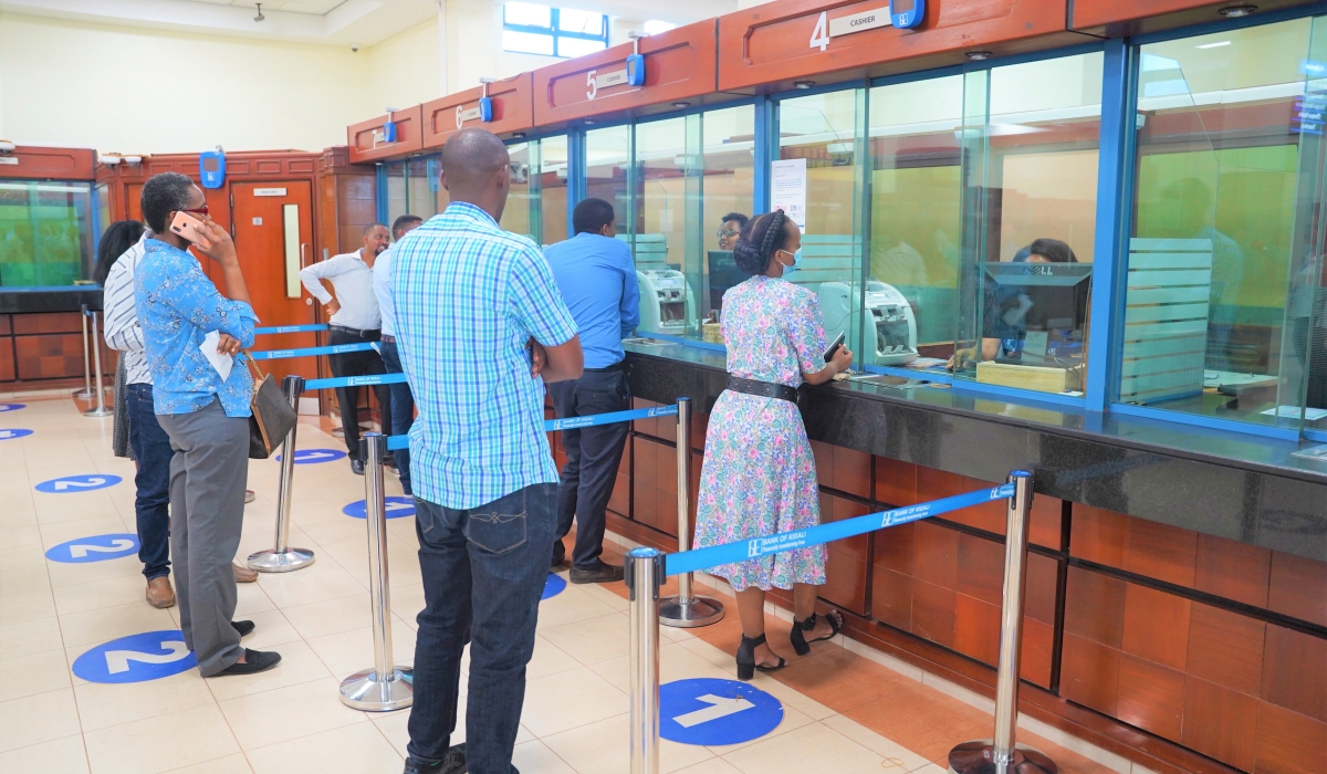 Bank tellers assist clients at the BK headquarters. African banks and financial institutions are beginning to explore alternative financing models that allow the continent to self-fund its development through more innovative
