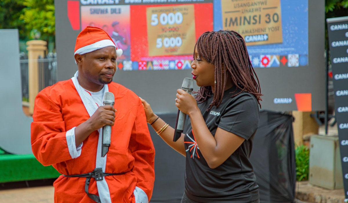 Gratien Niyitegeka, star of Zacu TV&#039;s Shuwa Dilu, and Sophie Tchatchoua, Managing Director of CANAL+ Rwanda, at Imbuga City Walk during the launch of the festive promo Buri Munsi Ni Ibirori on Friday, November 15.