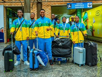 Members of the national karate team on arrival at Kigali International Airport, on Tuesday, December 3. The squad of five players returned home with three medals, including silver, from the 11th Commonwealth Karate Championships in Durban, South Africa-courtesy photos