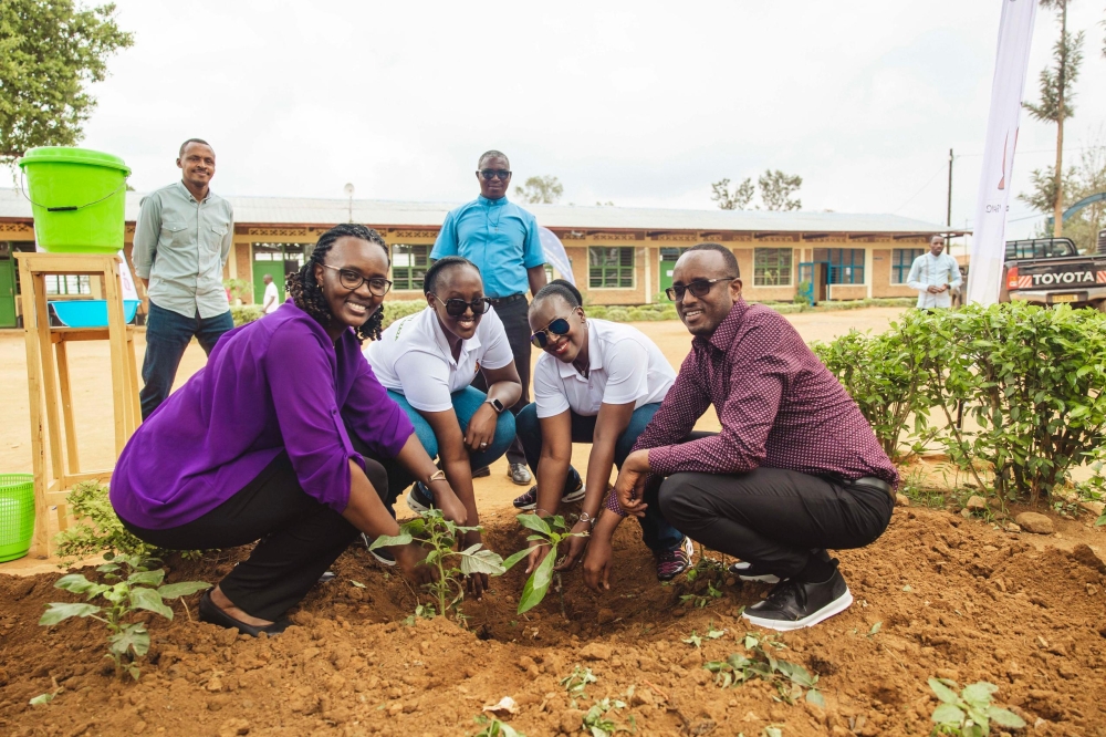Officials plant a tree at the school. Over 2000 seedlings were planted during the event on November 28. Officials plant a tree at the school. Over 2000 seedlings were planted during the event on November 28.