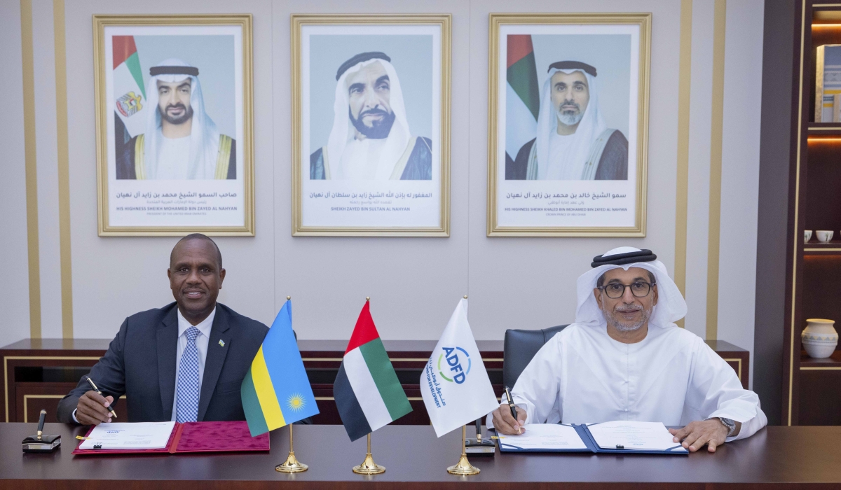 John Mirenge, the Ambassador of Rwanda to the UAE and Mohamed Saif Al Suwaidi, the Director General of Abu Dhabi Fund for Development sign the agreement in UAE.