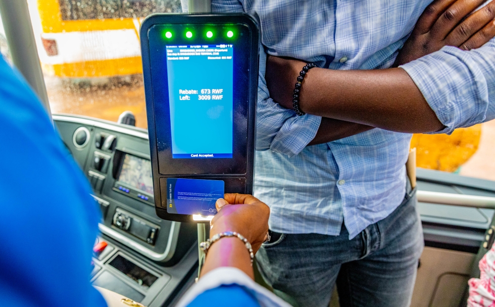 A passenger uses Tap&Go card to pay for transport fare. Tap&Go is among digital services developed by Rwandans companies and exported to other countries. Photo by Craish Bahizi