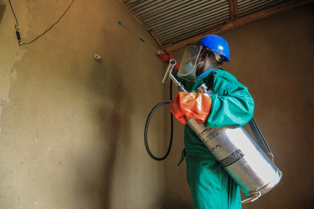 A health worker carries out residual mosquito spraying in Mugina, Kamonyi District. (File Photo)