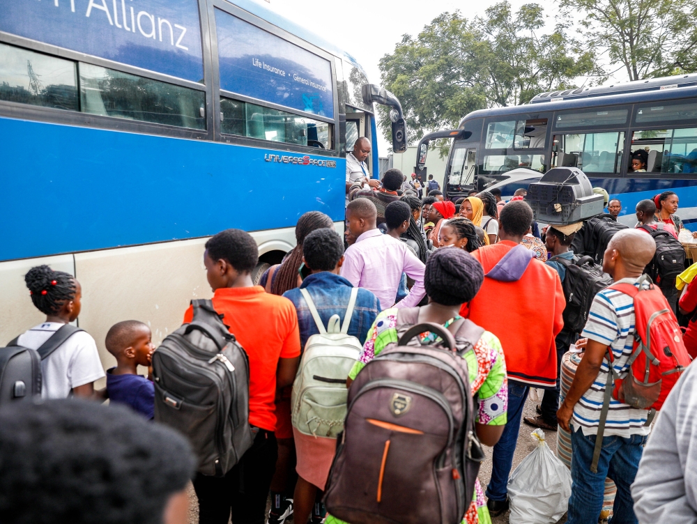 Long lines formed at Kigali Pele stadium as thousands of travellers turned up to board buses to join their families upcountry for festive season celebrations, on Tuesday, December 24. Photo by Craish Bahizi