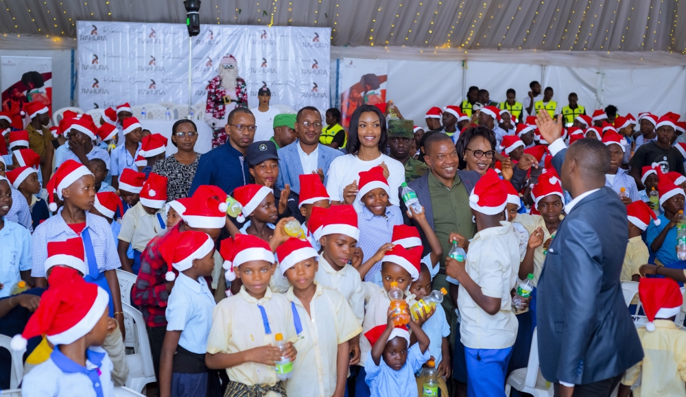 Kate Bashabe, her mother and Kicukiro District Executive Administrator Antoine Mutsinzi and other officials join children to celebrate Christmas-All photos courtesy