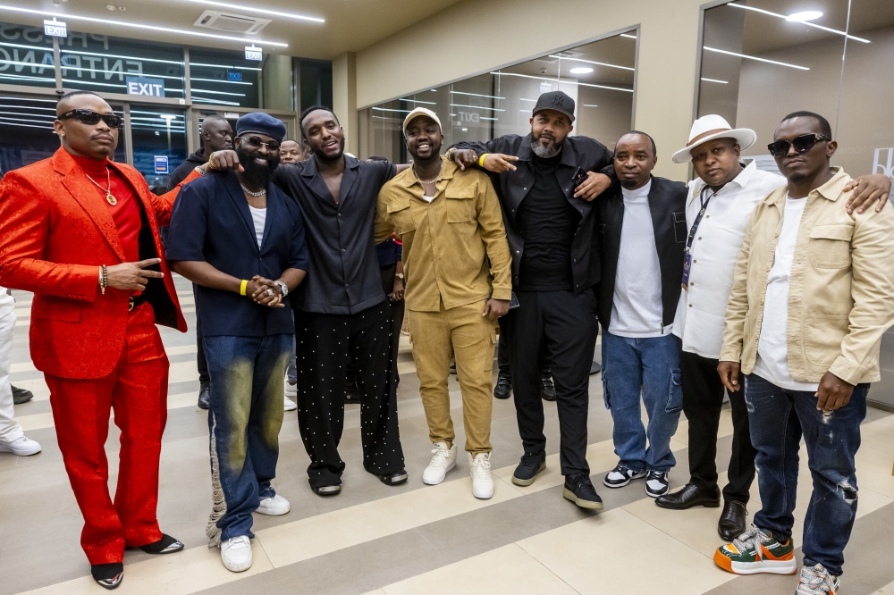 The Ben (C) poses for a photo with some of his friends  and supporters after concluding the show.