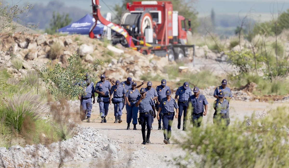 South African police officers conducting a rescue operation to retrieve illegal miners trapped in an abandoned gold shaft in Stilfontein. Courtesy Photo
