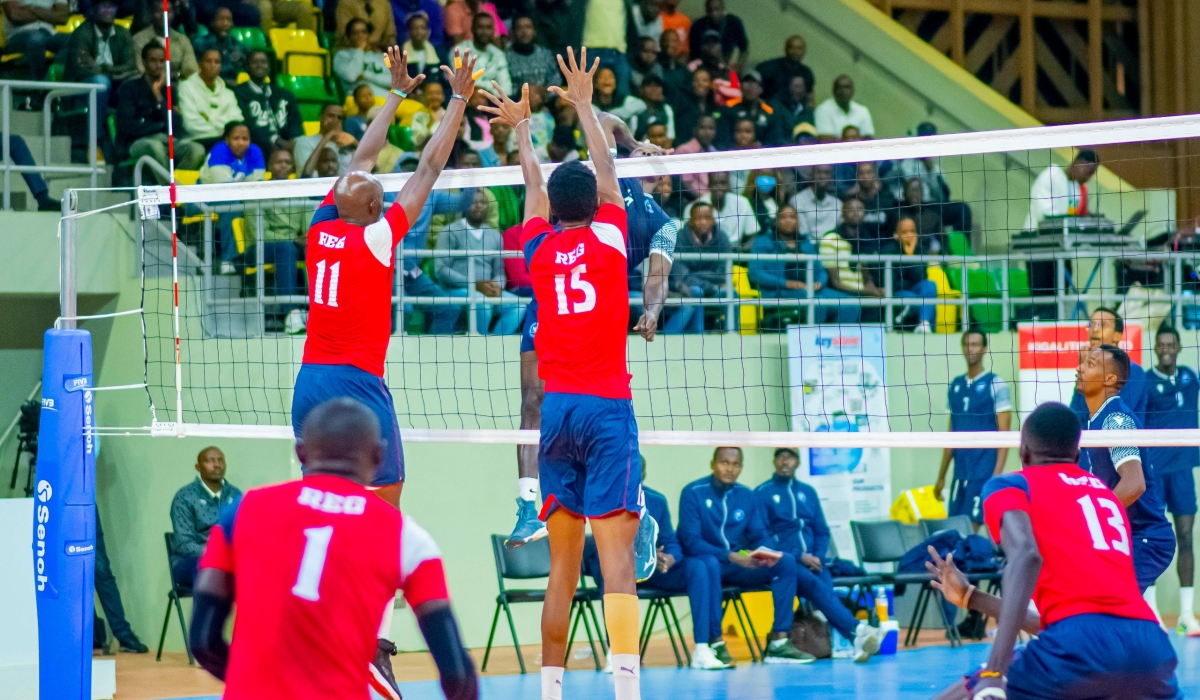 REG players attempt to make a block during the game. Photo by Dylan Mugenga