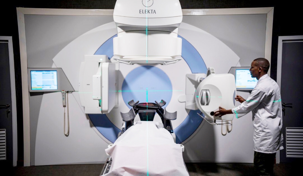 A medic shows how the newly installed machine functions inside the Radiotherapy cancer centre at Rwanda Military Hospital, in Kanombe. Courtesy