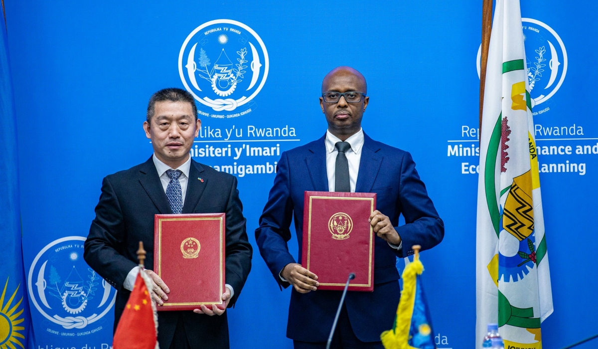 China’s Ambassador to Rwanda, Wang Xuekun and Minister of Finance Yusuf Murangwa pose for a photo at the signing ceremony on Wednesday, January 22. Photos by Dan Gatsinzi