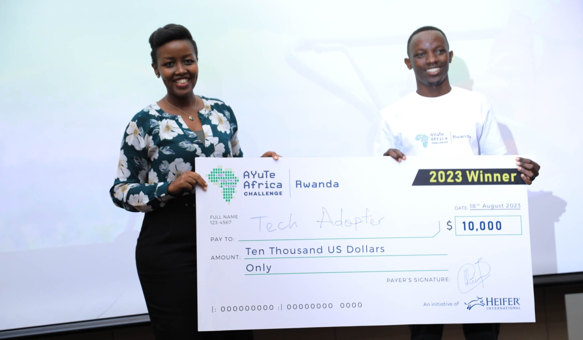 Paula Ingabire, Minister of ICT and Innovation, awards Israel Niyonshuti founder of Tech Adopter the winner of the 2023 AYUTE Africa Challenge, Rwanda, celebrating innovation in agriculture and technology.