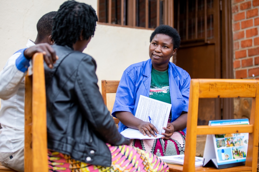 A Community Health Worker educates residents about malnutrition in Karongi District on December 9. Photos by Olivier Mugwiza