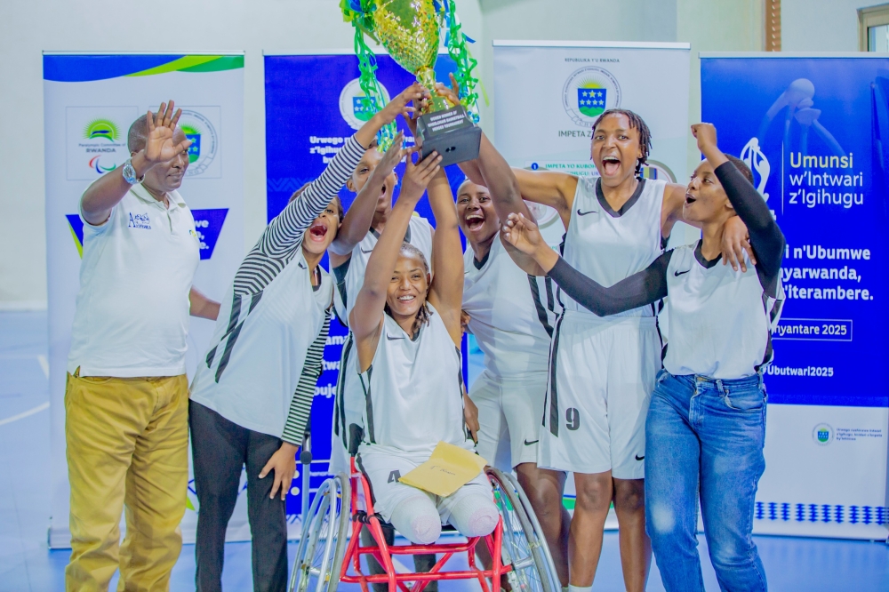 Kicukiro women&#039;s wheelchair basketball team celebrates with their trophy. Photo by Dylan Mugenga.