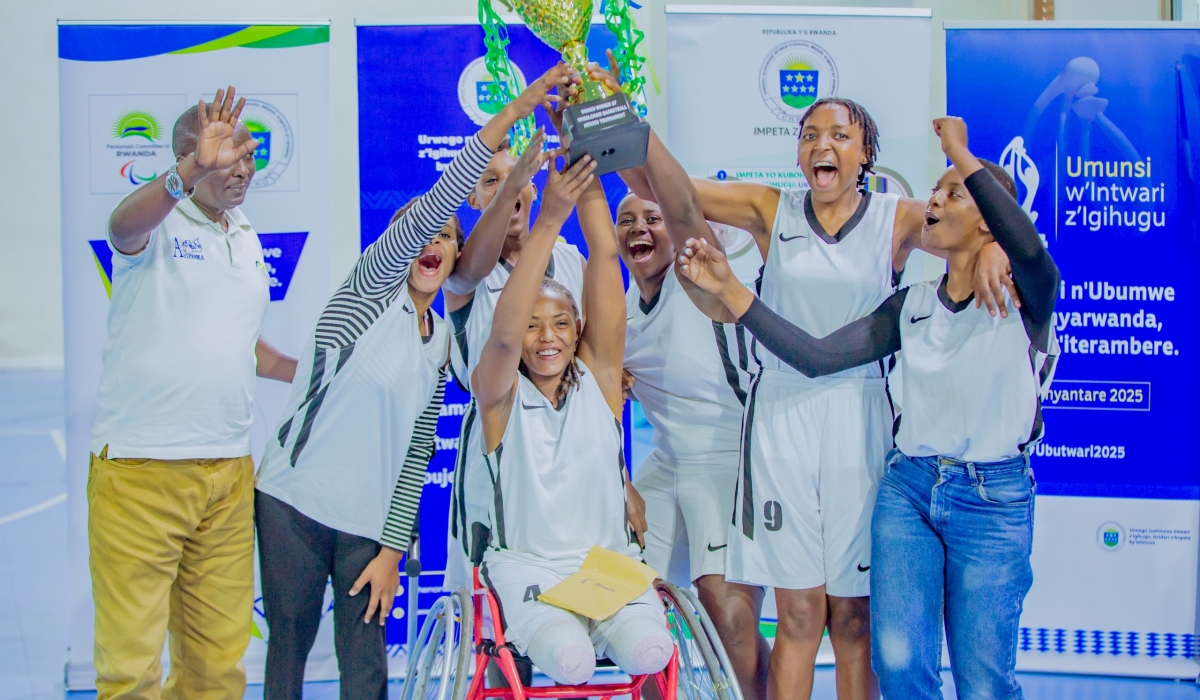 Kicukiro women&#039;s wheelchair basketball team celebrates with their trophy. Photo by Dylan Mugenga.