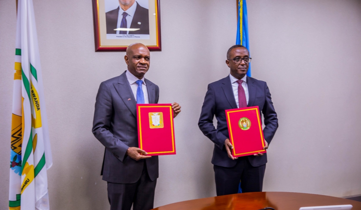 Rwanda&#039;s Minister of Interior, Vincent Biruta (R), and Guinea&#039;s Minister of Security and Civil Protection, Bachir Diallo, hold copies of the security cooperation MoU at the signing ceremony held in Kigali, on January 27, 2025 (courtesy). 