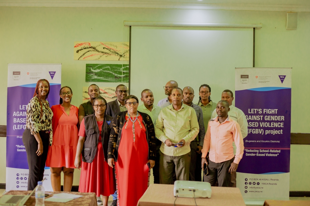 Participants pose for a photo after a meeting on the initiative that aims to reinforce safeguarding policies to create safer learning environments