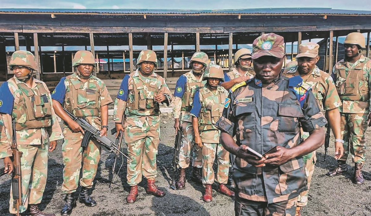 A Congolese officer speaks to South African soldiers who fight alongside the Congolese army in eastern DR Congo. Courtesy