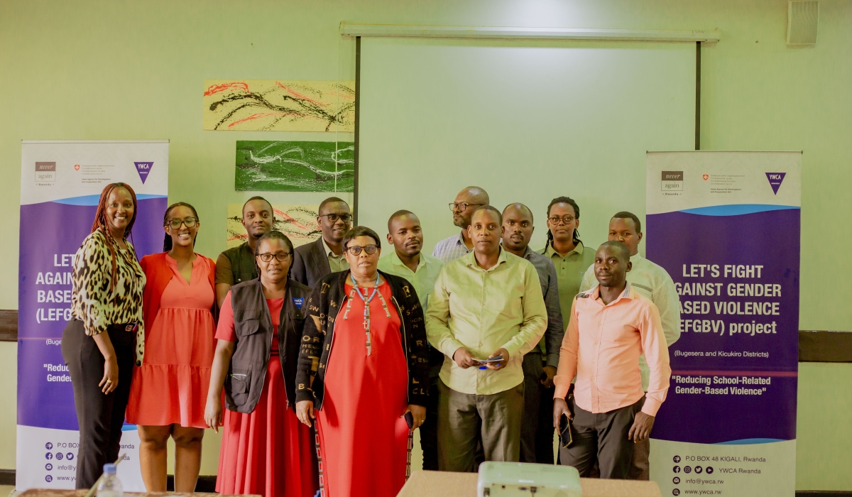 Participants pose for a photo after a meeting on the initiative that aims to reinforce safeguarding policies to create safer learning environments