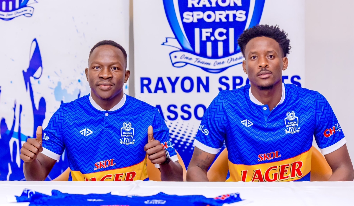 Assana (left) and Biramahire (right) after they signed the contract 