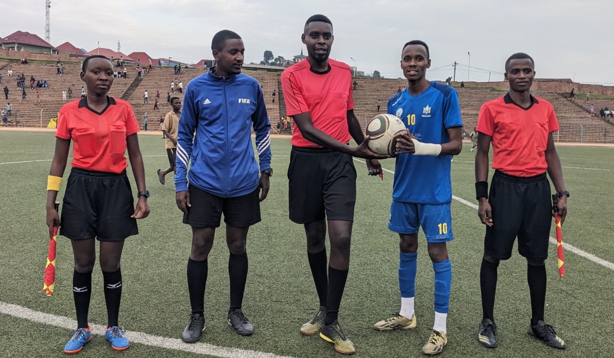 AS Muhanga winger Claude Kamoso Harerimana (2nd from right) receives the matchball for his hat trick against UR FC on Sunday, February 2-courtesy