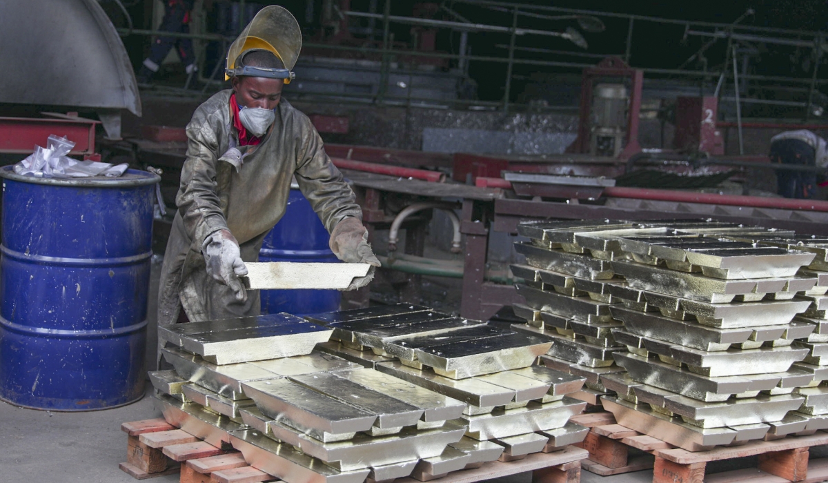 A worker arranges some melted tin for export in Kigali. Sam Ngendahimana