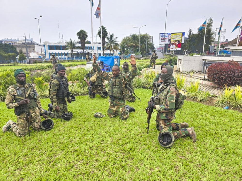 M23 rebels spokesperson Lt. Col. Willy Ngoma (center) and fighters celebrate after entering Goma City in eastern DR Congo on Tuesday, January 28. Courtesy