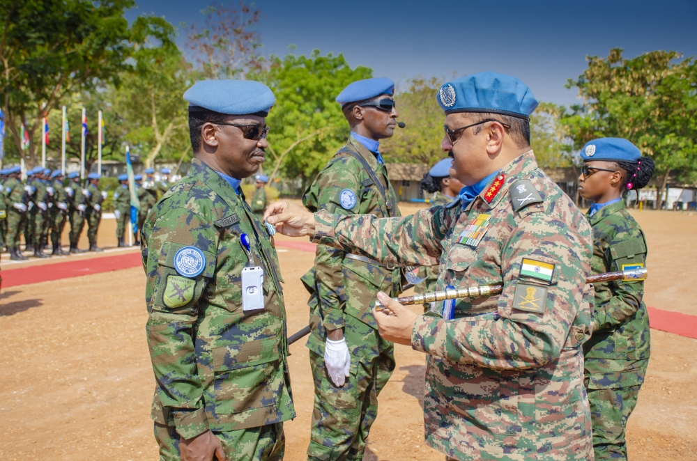 UNMISS Force Commander Lt Gen Mohan Subramanian (right) decorates Lt Col Emmanuel Ntwali, the RWABATT-1 Contingent Commander, with a UN service medal at the UN Tomping Base Camp in South Sudan’s capital, Juba, on Wednesday, February 12. Courtesy of RDF