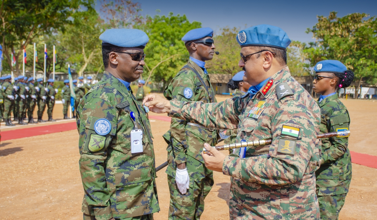 UNMISS Force Commander Lt Gen Mohan Subramanian (right) decorates Lt Col Emmanuel Ntwali, the RWABATT-1 Contingent Commander, with a UN service medal at the UN Tomping Base Camp in South Sudan’s capital, Juba, on Wednesday, February 12. Courtesy of RDF