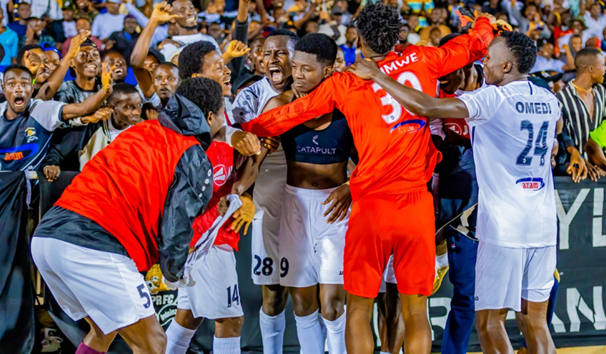 APR FC players crowd match hero Mamadou Sy after his late winner powered his side to a 2-1 victory over AS Kigali on Sunday, February 16, at Kigali Pele Stadium-Photo by IGIHE